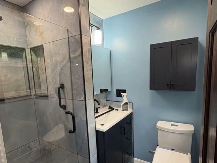 Full bath remodel — tiled shower, custom vanity wall